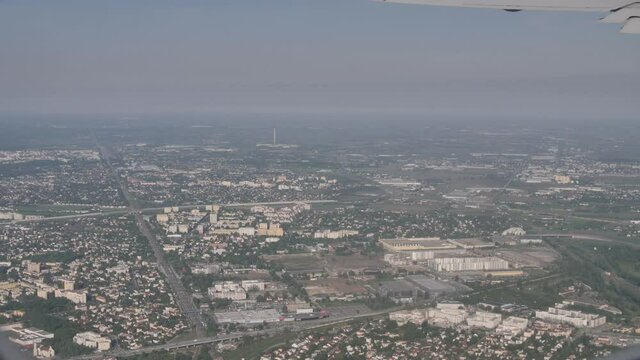 Shot of a Greek aglomaration from the window of a plane with hot and beautiful clear weather.
