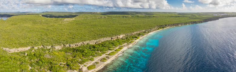 Aerial view above scenery of Curacao, Caribbean with ocean, coast, hills 