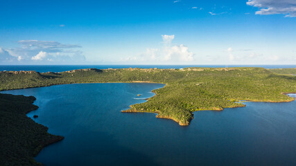 Aerial view above scenery of Curacao, Caribbean with ocean, coast, hills 