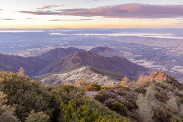 Sunset over Eagle Peak and Bald Ridge via the Main Peak, with the city of Clayton in the...