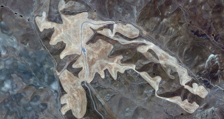 the mass grave, United States, abstract photography of relief drawings in  fields in the U.S.A....
