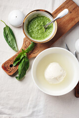 Mozzarella cheese and pesto sauce.