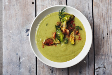 Broccoli cream soup with brussels sprouts and bacon.
