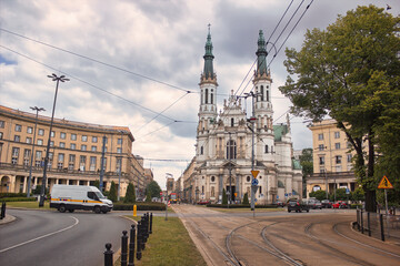 Obraz premium Warsaw, Poland - June 01, 2017: Church of the Holiest Saviour, plac Zbawiciela, Saviour Square, Srodmiescie Poludniowe located in Central Europe against cloudy sky