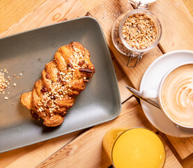 breakfast with brioches, chocolate,  cappuccino and fresh squeezed orange juice