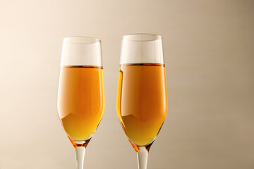 Two glasses of champagne on a gray background. Alcoholic drink: champagne, beer, white wine. New year and Christmas background. Valentine's Day.