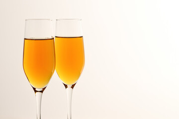 Two glasses of champagne, wine on a gray background. Alcoholic drink: champagne, beer, white wine. New year and Christmas background. Valentine's Day