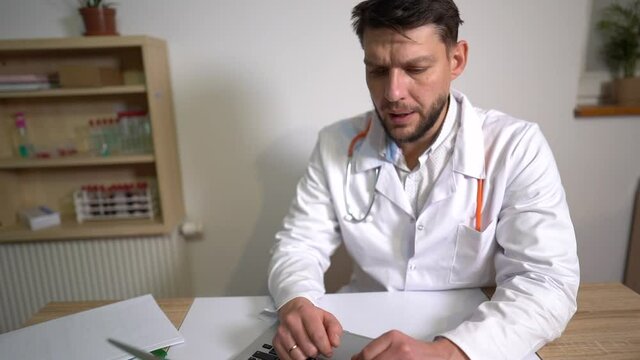 Online medicine, a young doctor therapist consults online. New normalcy, medicine during the covid-19 coronavirus pandemic