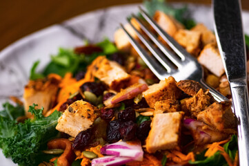 Healthy salad with grilled meat.