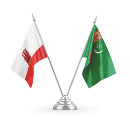 Turkmenistan and Gibraltar table flags isolated on white 3D rendering