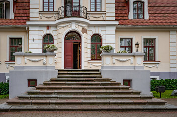  Close-up of manor entrance. Entranceway to the Sventes Manor with open door. Latvia.