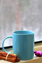 cup of coffee with cinnamon sticks