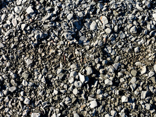 Natural river stony bottom, shallow riverbed during autumn weather on a Sunny day in a mountainous area.