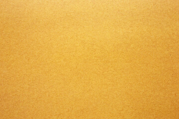 Yellow paper or cardboard texture for background.