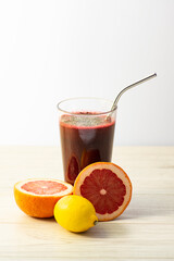 A fresh glass of juiced fruits and vegetables with copy space.