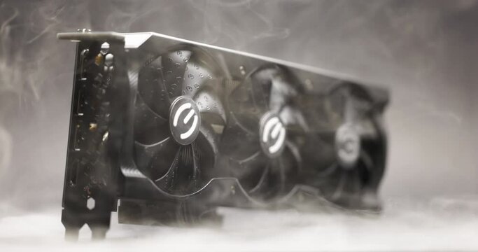 Graphics card with smoke rising and dark background