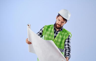 man in construction uniform blueprints professional engineer work blue background