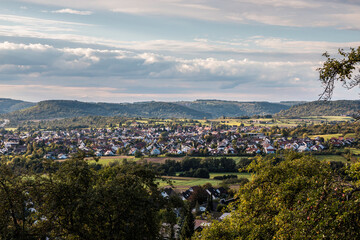 Apple trees with red apples near the village