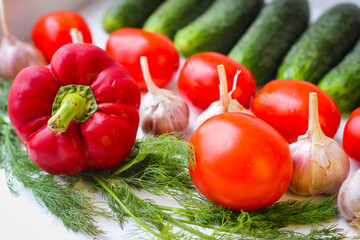 Good organic cucumbers and red tomatoes and garlic