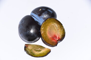 plums on a white background