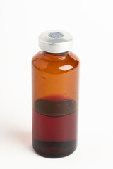 Macro Image Of Amber Vaccine Vial In White Background