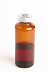 Macro Image Of Amber Vaccine Vial In White Background