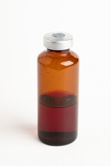 Macro Image Of Amber Vaccine Vial In White Background