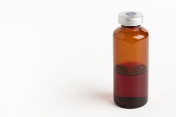 Macro Image Of Amber Vaccine Vial In White Background