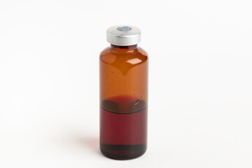 Macro Image Of Amber Vaccine Vial In White Background