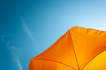 yellow parasol and blue sky
