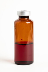Macro Image Of Amber Vaccine Vial In White Background