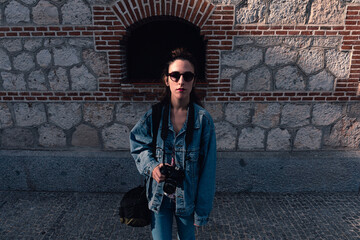 Woman waiting with her photo camera