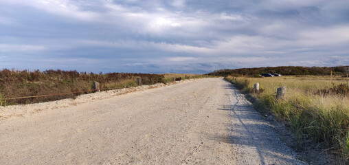Dirt road by the long strip of Duxbury beach