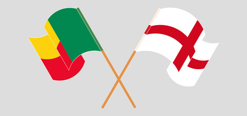 Crossed and waving flags of England and Benin