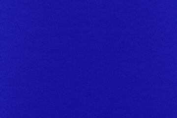 Clean purple retro paper background. Vintage violet cardboard texture. Grunge paper for drawing. Simple blank fabric pattern.