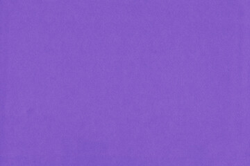 Clean purple retro paper background. Vintage violet cardboard texture. Grunge paper for drawing. Simple blank fabric pattern.
