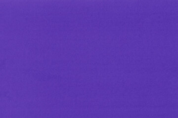 Clean purple retro paper background. Vintage violet cardboard texture. Grunge paper for drawing. Simple blank fabric pattern.