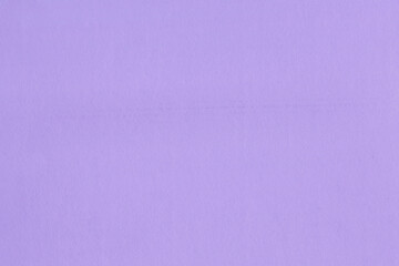Clean purple retro paper background. Vintage violet cardboard texture. Grunge paper for drawing. Simple blank fabric pattern.