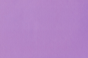 Clean purple retro paper background. Vintage violet cardboard texture. Grunge paper for drawing. Simple blank fabric pattern.