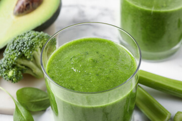 Delicious fresh green juice in glass, closeup