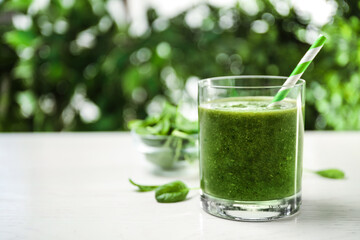 Delicious fresh green juice on white table, space for text - Powered by Adobe
