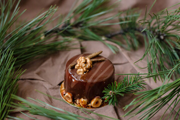 New Year's cake, sweetness, delicious cake, on the New Year's table, spruce, beads, lights, food, nuts, chocolate, gold