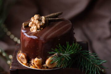 New Year's cake, sweetness, delicious cake, on the New Year's table, spruce, beads, lights, food, nuts, chocolate, gold