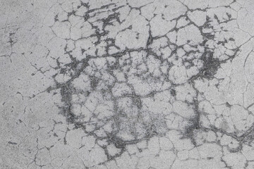 Cracks on the cement wall.