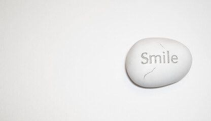 Egg shaped stone with a word 