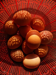 close up of eggs in the red basket