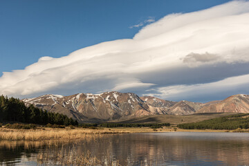 Landscape view of lenticular clouds over the lake during afternoon in Esquel, Patagonia, Argentina
