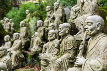 Fototapeta na wymiar groups of buddhist arhat stone statue