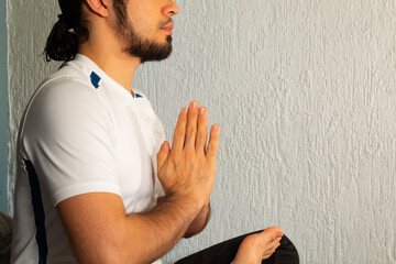 close up of the hands of a man in sportswear doing yoga and meditation