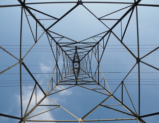 high voltage tower with many lines and blue sky 